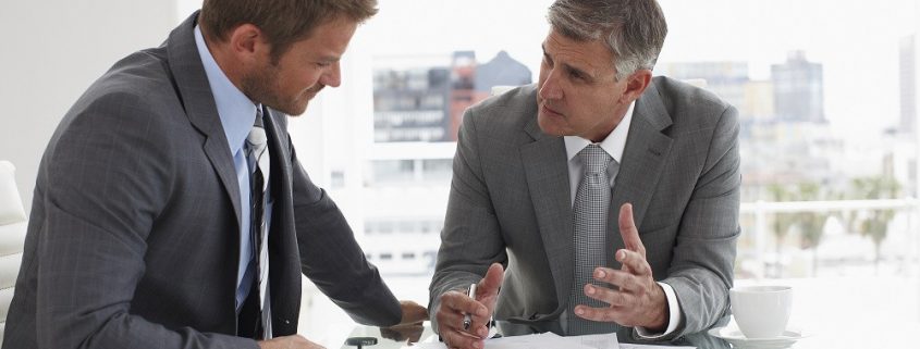 Two men at a meeting